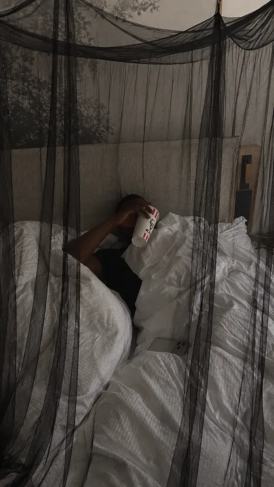 South African customer relaxing under a black NestHaven net