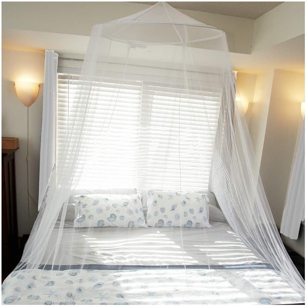 Bright bedroom with a NestHaven white mosquito net
